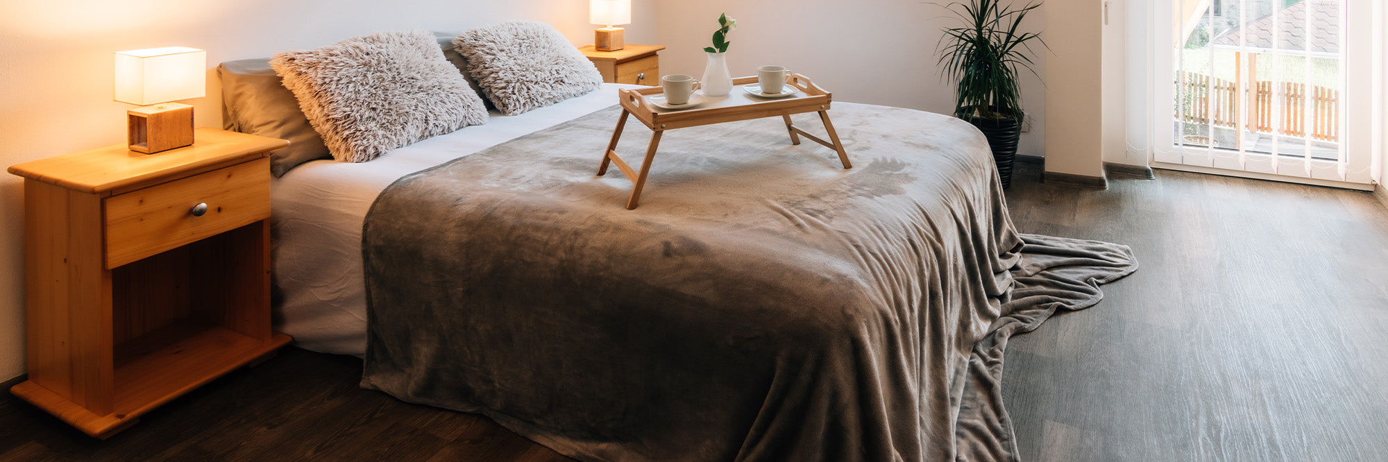 Mattress Dimensions and Blanket Sizes - Featuring a luster loft fleece blanket in a modern bedroom, American Blanket Company