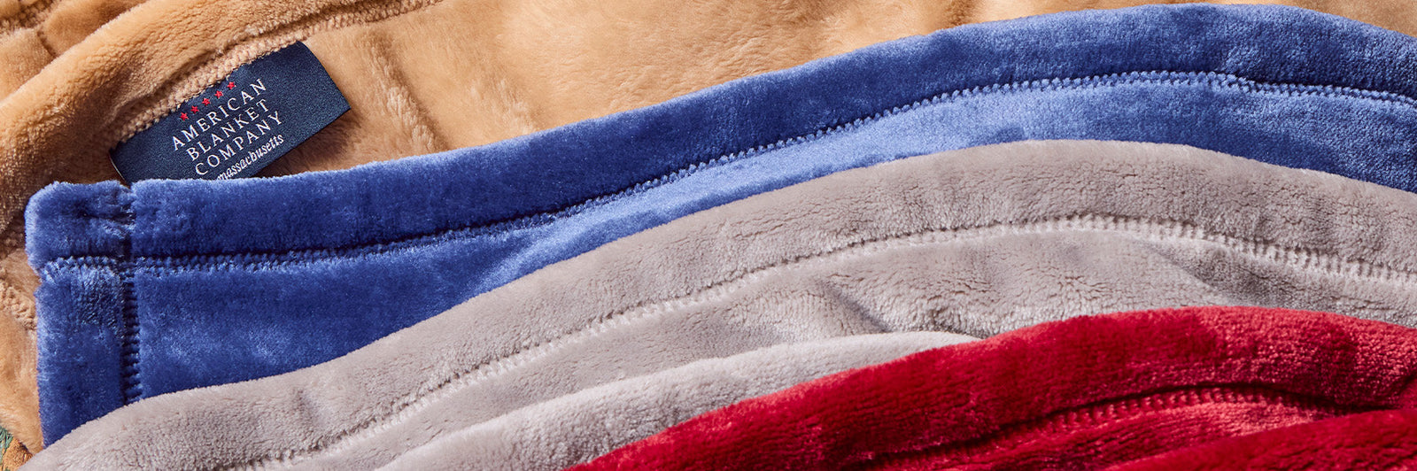 American Blanket Company - Rows of colorful luster loft fleece blankets