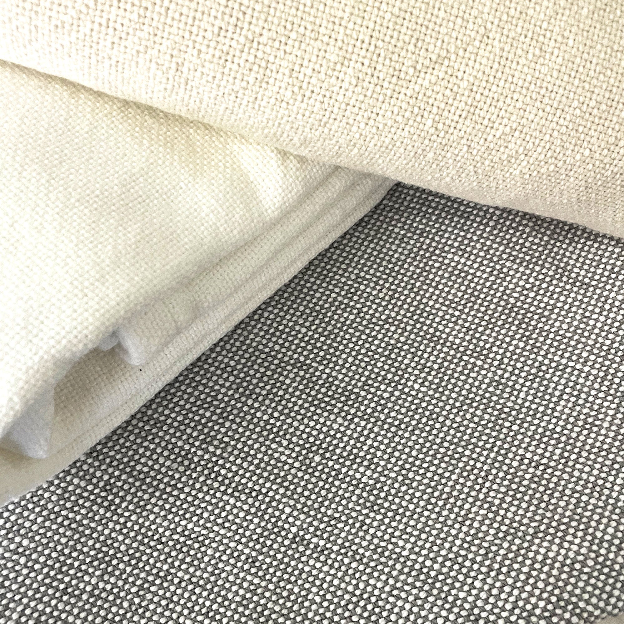American Blanket Company - 100% Cotton Blanket, Cotton Sweater Weave Blanket - Folded Cotton blankets in the sweater weave pattern in the colors of cream, white, and Gray White.