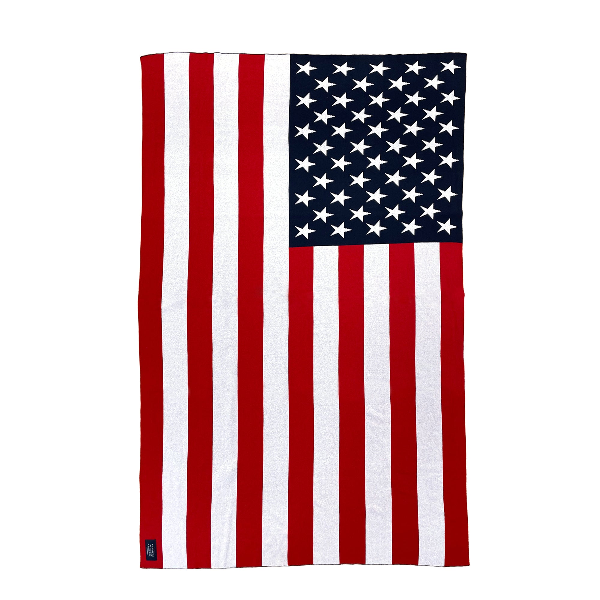 AMERICAN BLANKET COMPANY - KNITTED FLAG BLANKETS - Flat laied out blanket showing all stripes and american blanket company sew in tag in the lower left corner.
