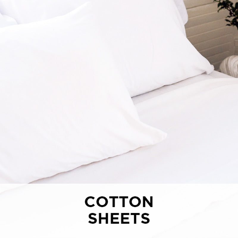 AMERICAN BLANKET COMPANY - 100% COTTON SHEETS - A BED MADE UP WITH CRISP WHITE COTTON SHEETS AND PILLOWCASES