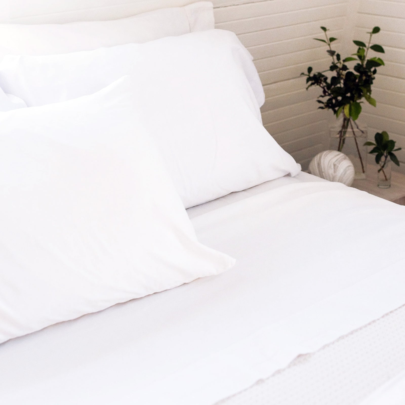 AMERICAN BLANKET COMPANY - 100% COTTON SHEETS - A BED MADE UP WITH CRISP WHITE COTTON SHEETS AND PILLOWCASES