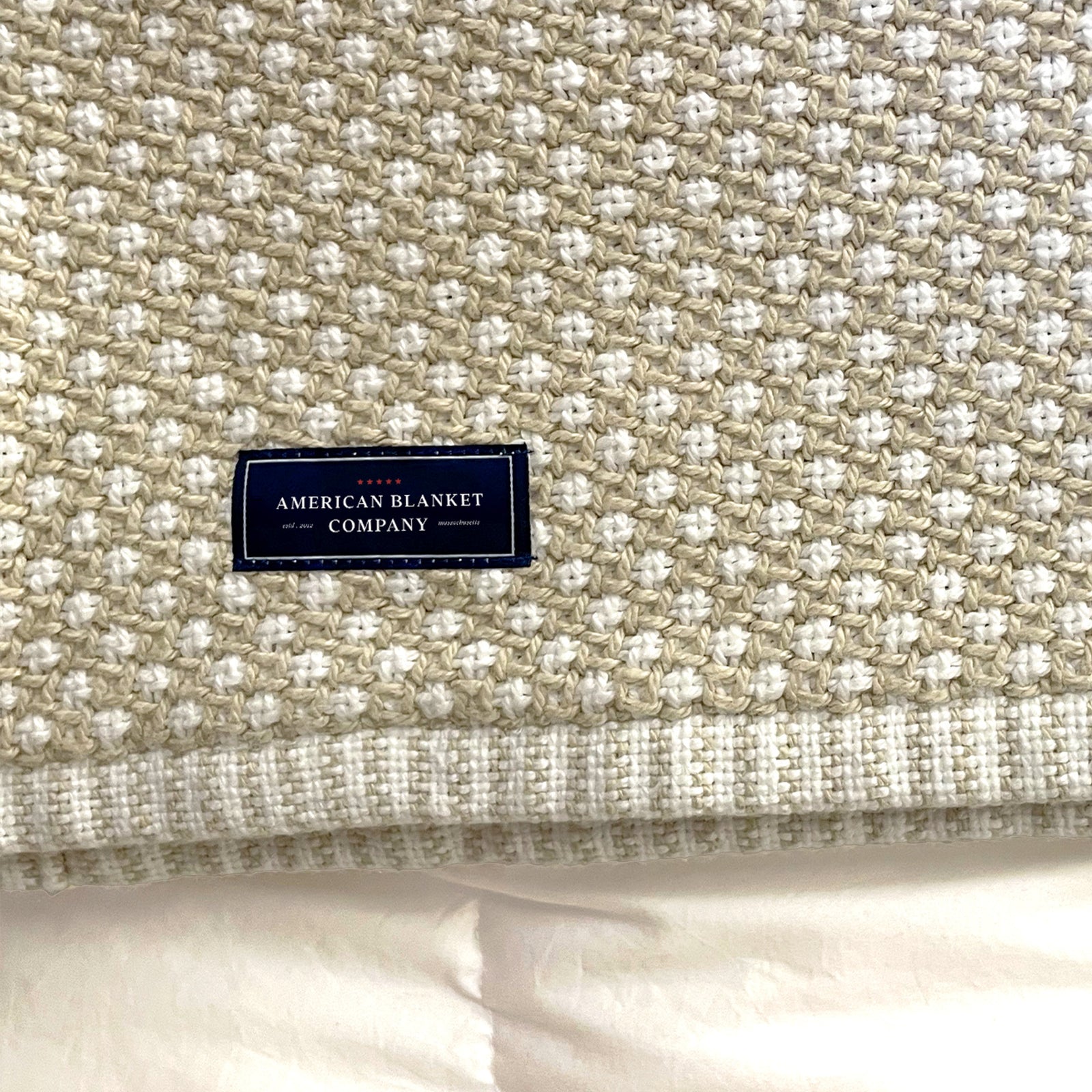 American Blanket Company - Cotton Blanket, 100% Cotton Lattice Weave Blanket - Detail shot of the woven natural and white lattice weave, and a closeup of the woven hemmed edge.