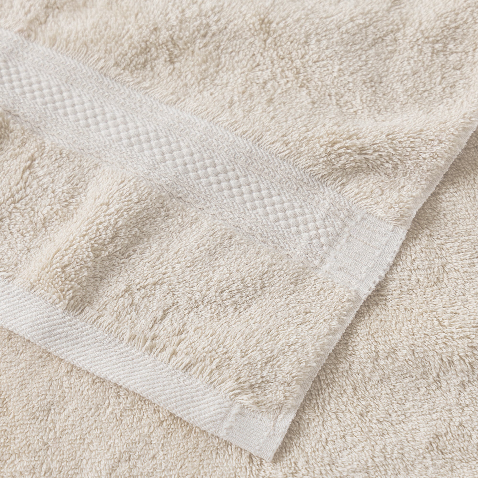 AMERICAN BLANKET COMPANY - COTTON TOWELS - OFF WHITE COTTON TOWELS CLOSE UP DETAIL OF HEMMED EDGE AND DOBBY STRIPE