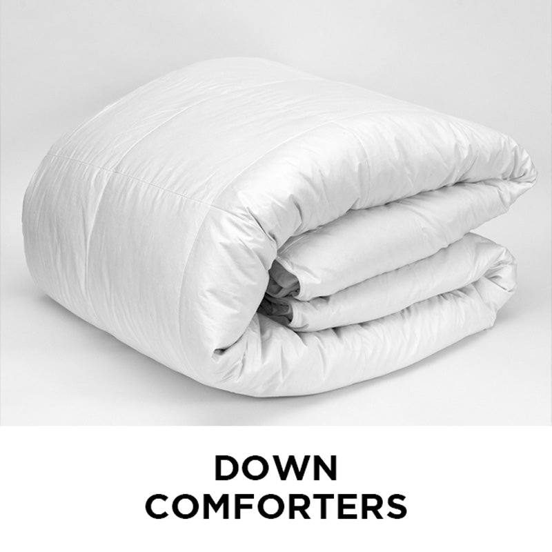 AMERICAN BLANKET COMPANY - DOWN COMFORTERS - A FOLDED, WHITE, THICK DOWN COMFORTER ON A WHITE BACKGROUND