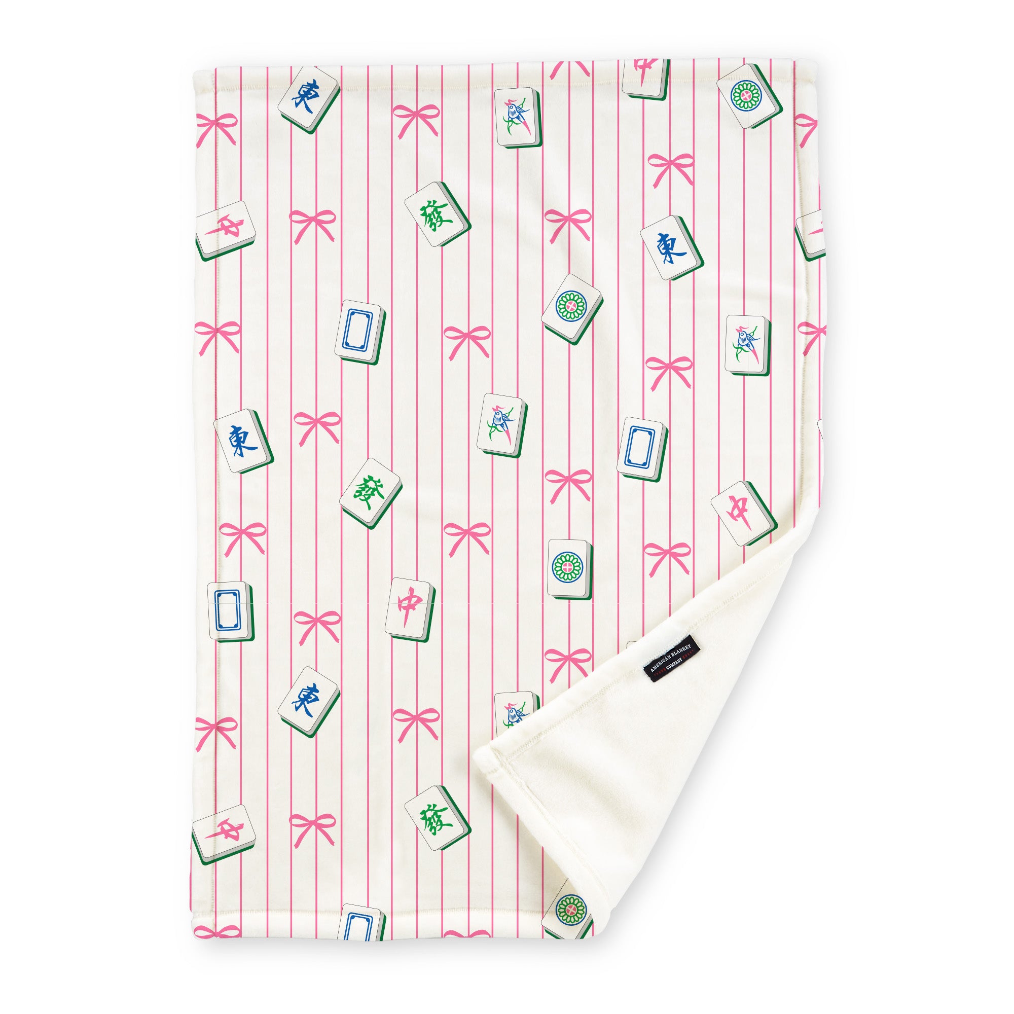 American Blanket Company - Fleece Mahjong Blanket with an assortment of tiles on a pink lined background with ribbons