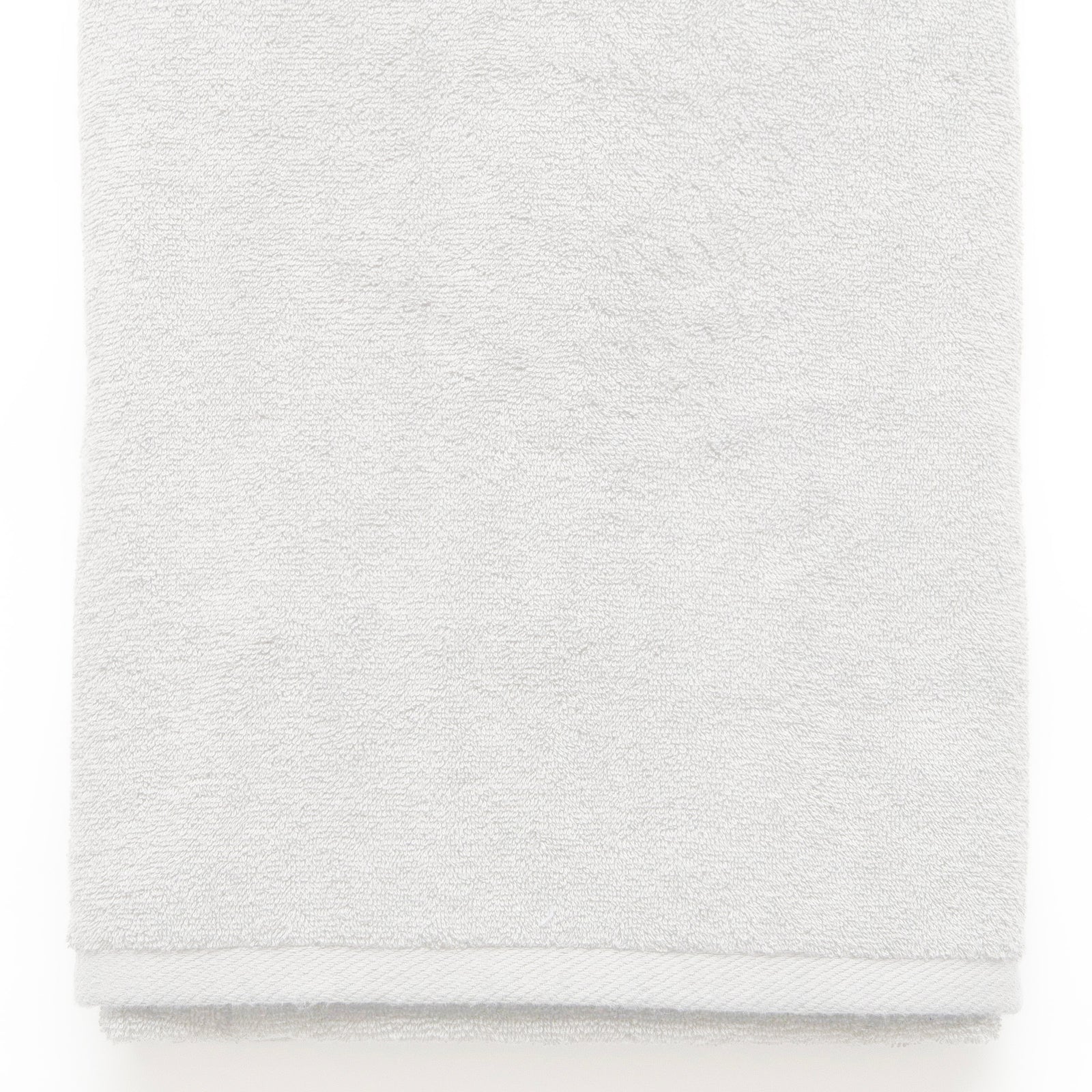 American Blanket Company -  Colorful Made in the USA 100% Cotton towels - Folded white towel on a white background