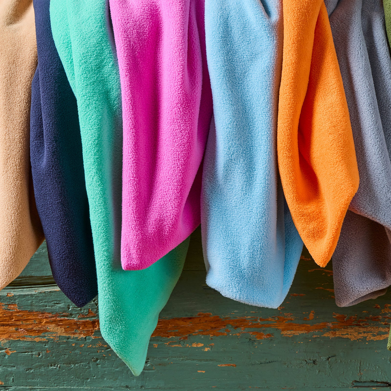 AMERICAN BLANKET COMPANY - PEACEFUL TOUCH BLANKETS - COLORFUL PEACEFUL TOUCH BLANKETS FALLING OUT OF A BASKET