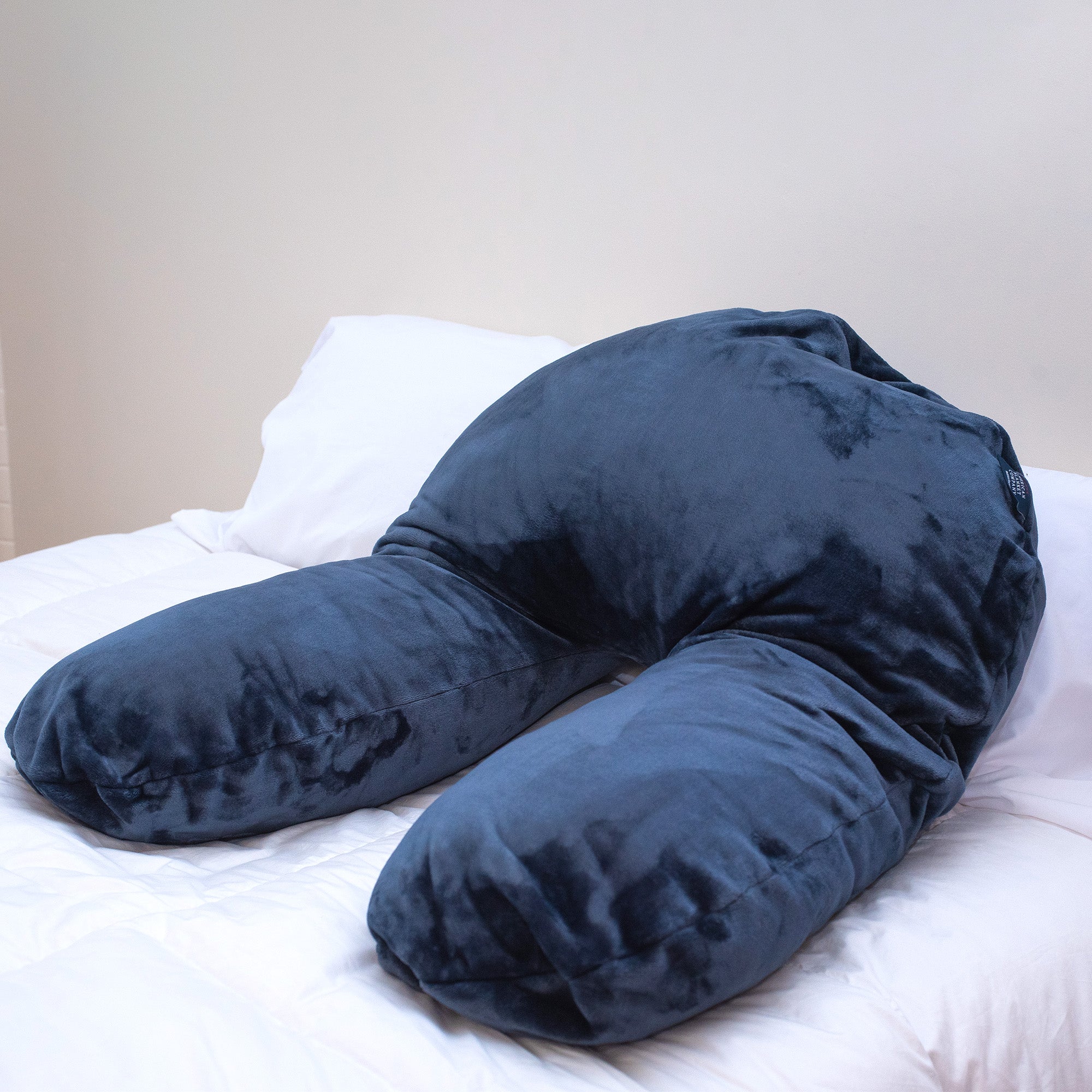 American Blanket Company - Fleece Bolster Pillow - Atlantic Blue Luster Loft Bolster Pillow on bed