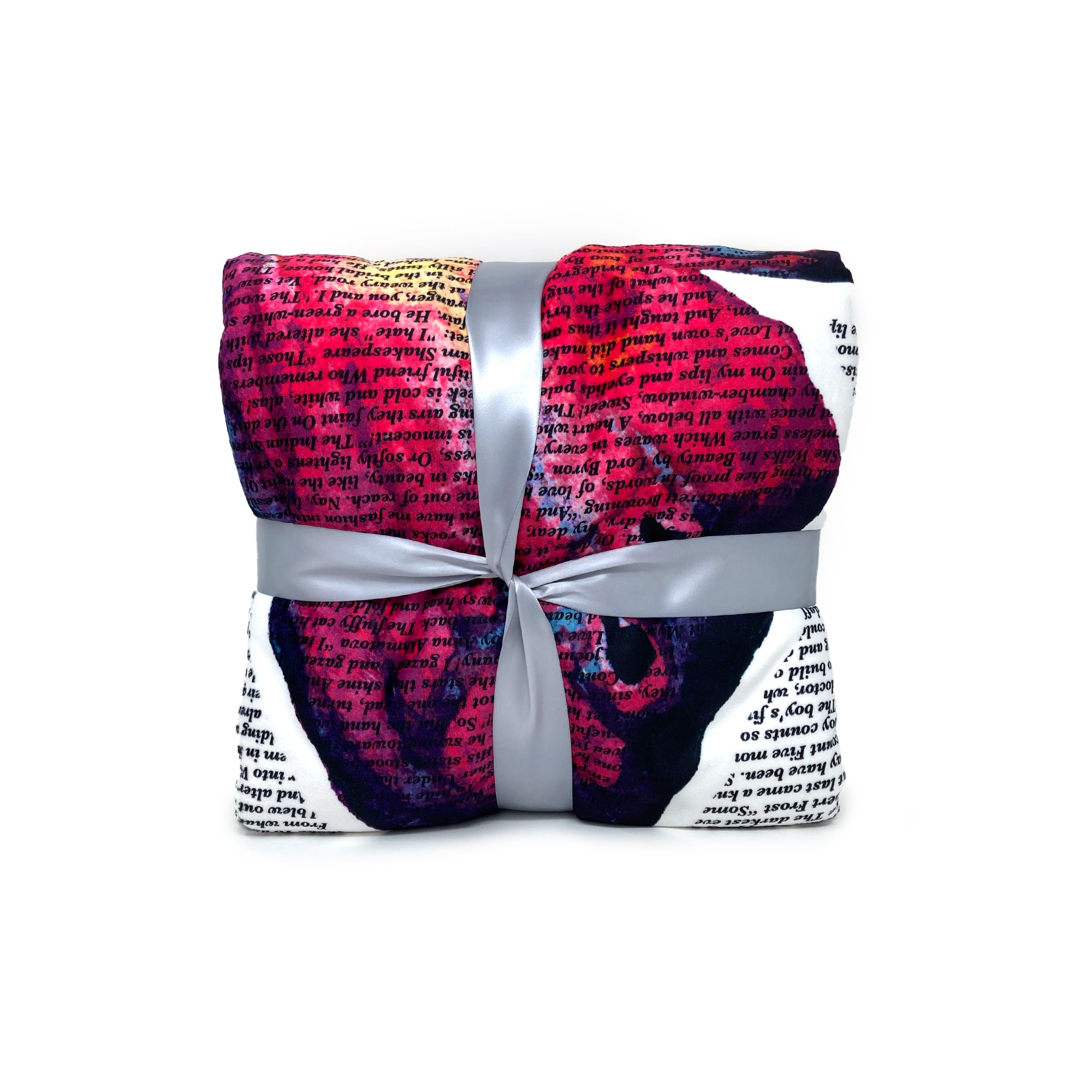 American Blanket Company - Butterfly Printed inspirational poem blanket - Folded detail shot of the vibrant butterfly blanket, tied with a ribbon and a hangtag.