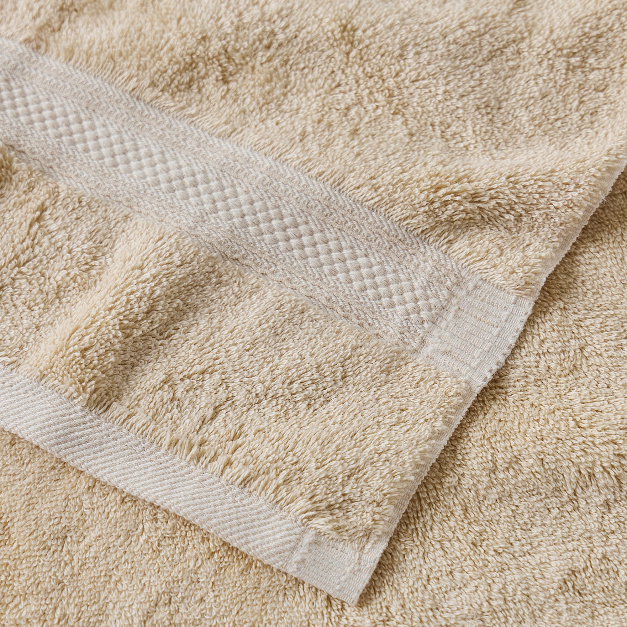 AMERICAN BLANKET COMPANY - COTTON TOWELS - GOLDEN COTTON TOWELS CLOSE UP DETAIL OF HEMMED EDGE AND DOBBY STRIPE