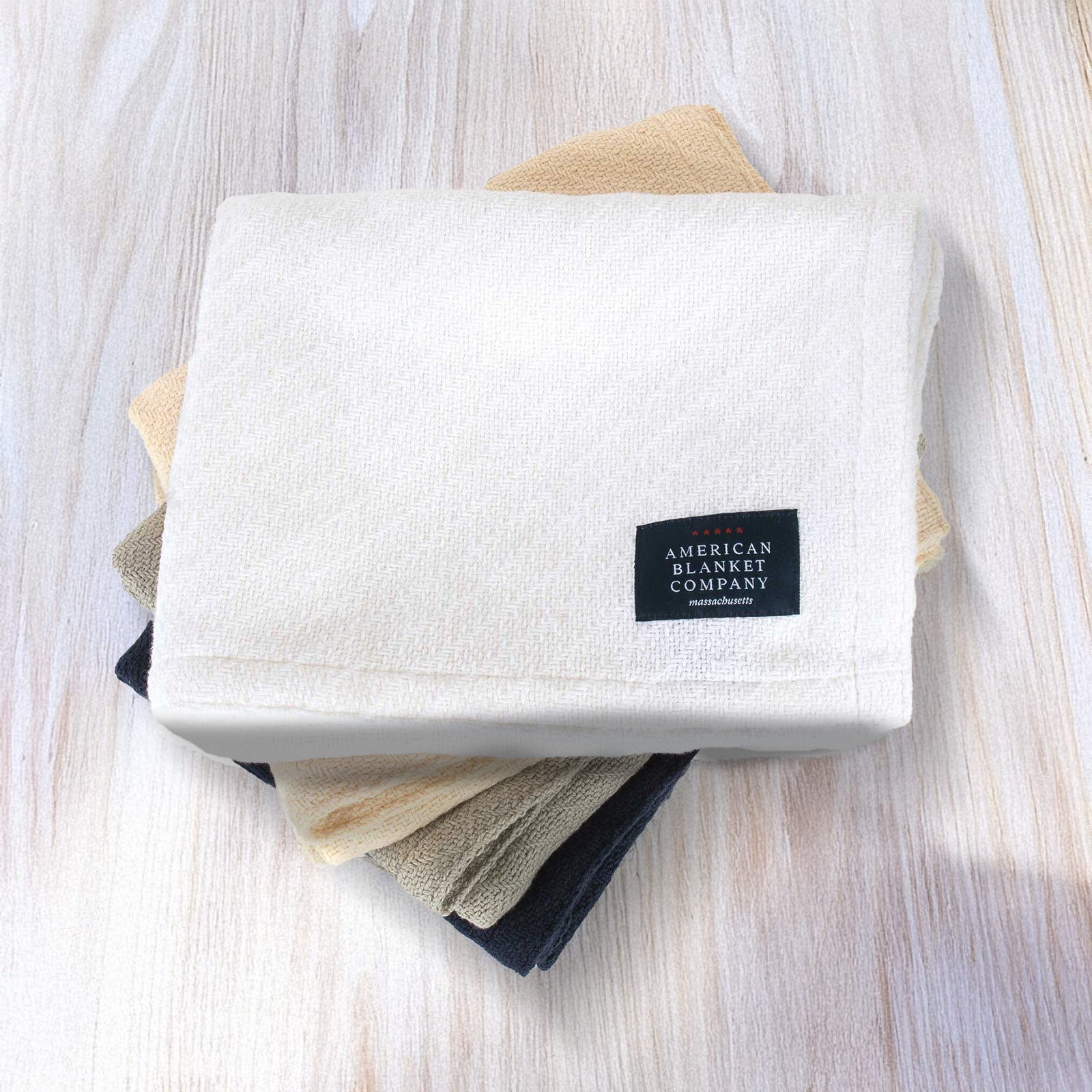American Blanket Company - Cotton Baby Blankets - Stack of cotton baby blankets white-natural-gray-navy