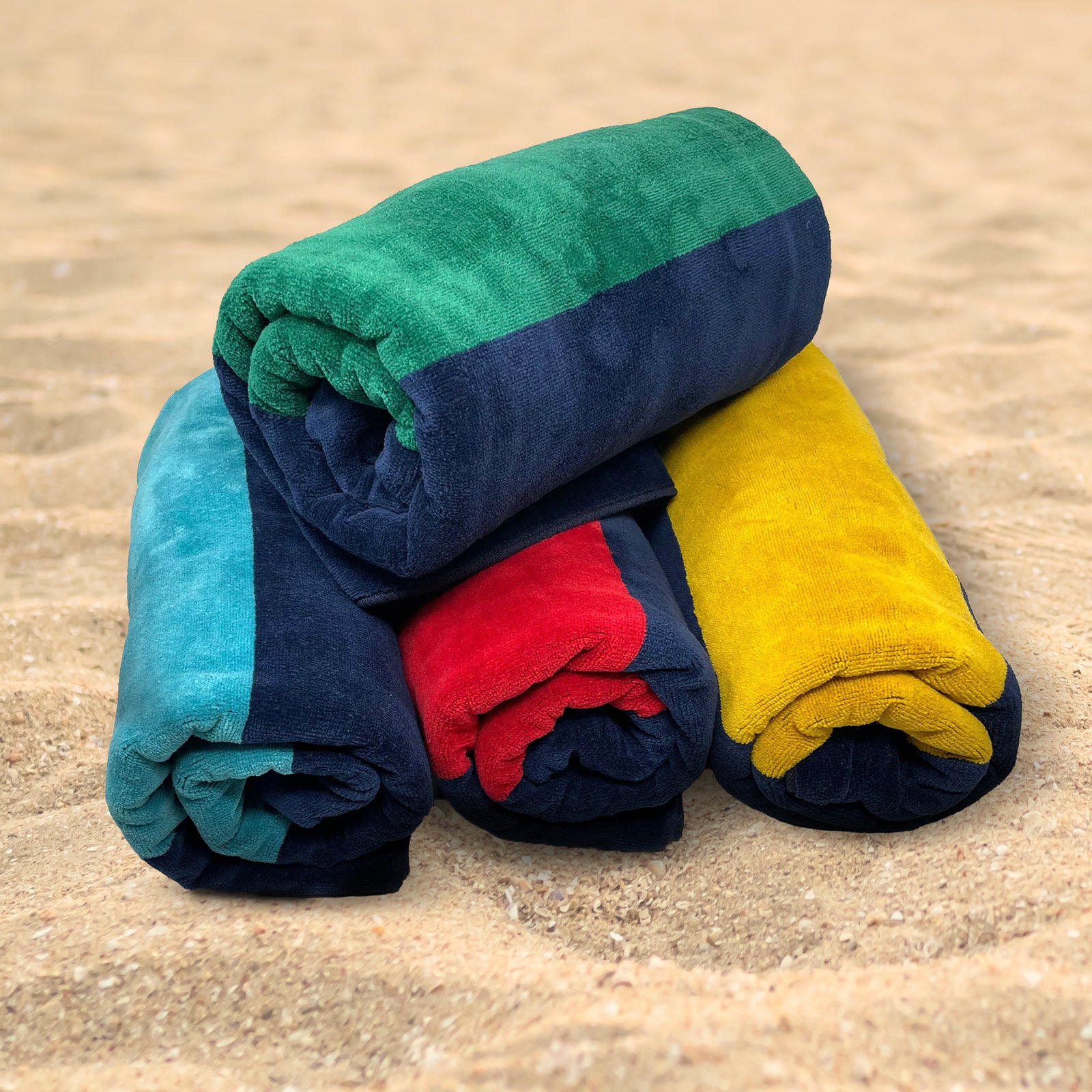American Blanket Company - Rugby Stripe Cotton Beach Towels - stack of 4 rugby blankets in assorted color on a white background.