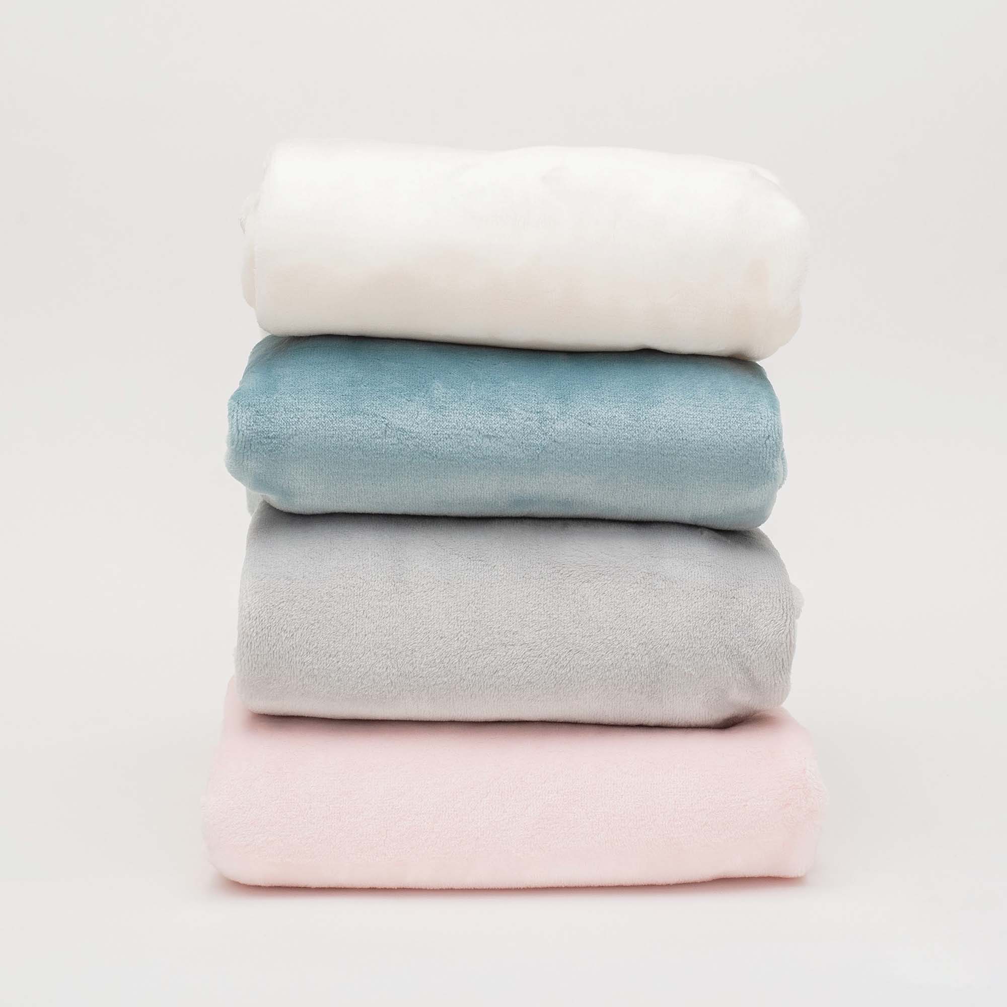 American Blanket Company - Luster Loft Fleece Whip Stitched Baby Blankets - Stack of fleece whip stitched baby blankets - light blue, gray, cream, and pink.