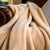 Latte Colored Luster Loft Fleece Blanket on leather armchair - Luster Loft Fleece Blankets - Luster Loft Fleece Throws - American Blanket Company