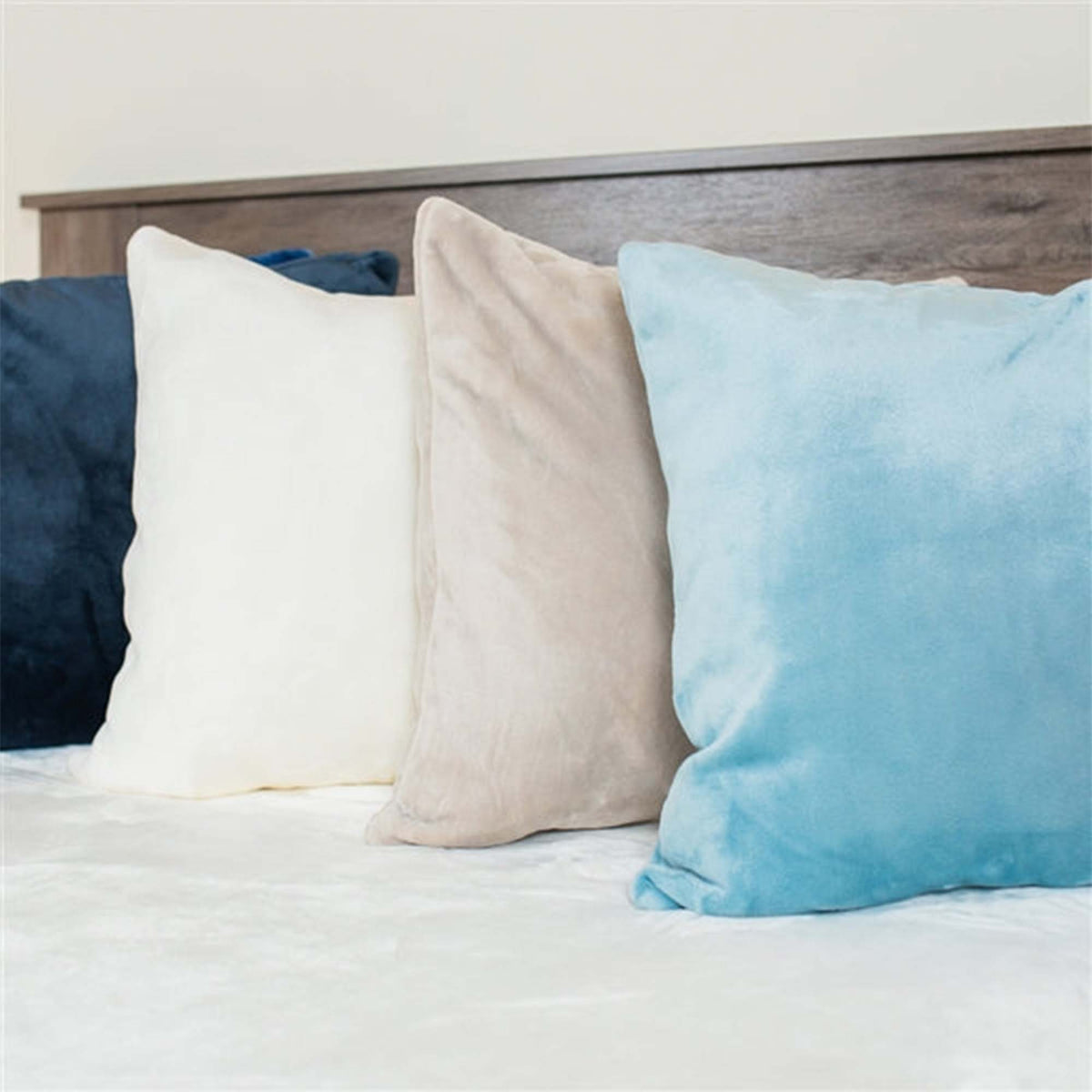 Assorted Luster Loft Fleece Throw Pillows On Bed  - Luster Loft - luster loft fleece throw pillows - American Blanket Company