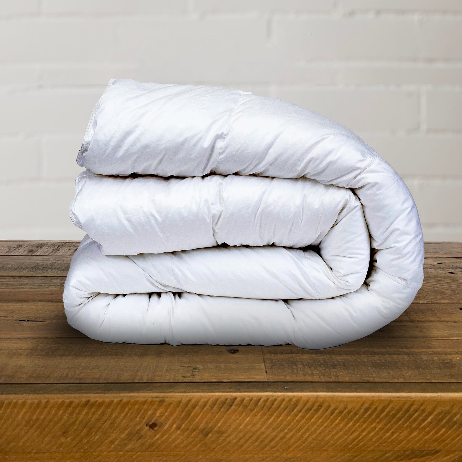 American Blanket Company - Down Comforter Heavy Weight - Side view folded fluffy white down heavy weight comforter